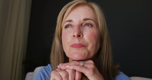 Close up of caucasian senior woman holding a walking stick at home