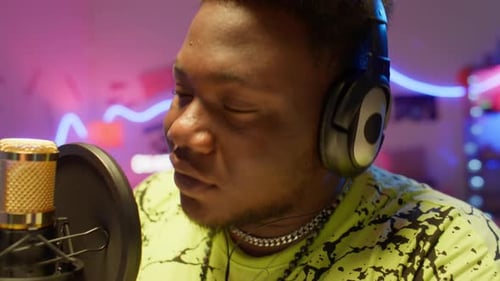 African American Man Recording Rap Song in Studio