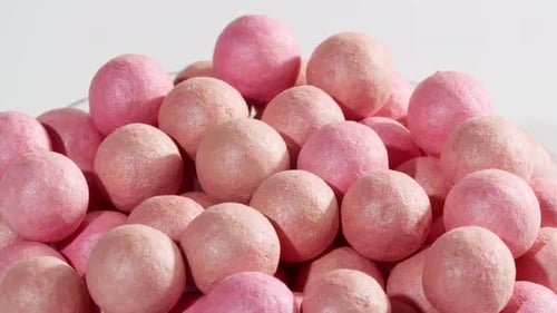 Pink Cosmetic Blush Balls Rotating Close Up