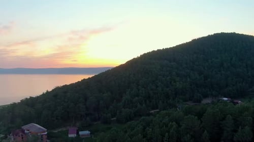 Flight Over the Forest on the Shore of the Lake