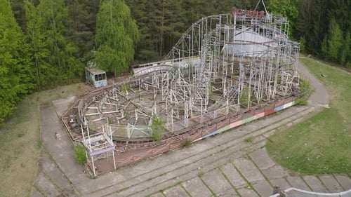 Abandoned Roller Coaster and Overgrown Amusement Park Aerial