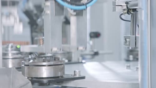 Advanced robotic machine manufacturing parts in an automated assembly line
