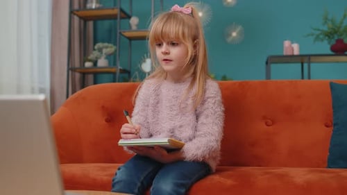 Girl Learning Online and Drawing at Home