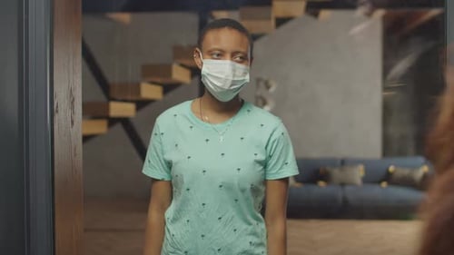 Black Female in Medical Mask Stay Isolated at Home