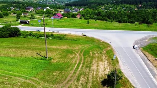 Aerial drone view of a flying over the rural agricultural landscape.