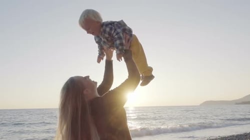 Mom and Son Having Fun on the Beach