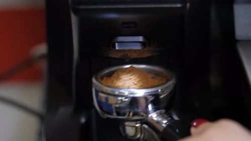 Coffee Grinds Being Dispensed into Portafilter