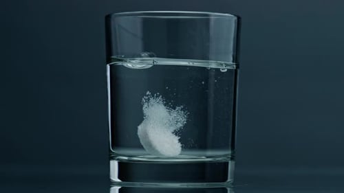 Tablet Dissolving in a Glass of Water