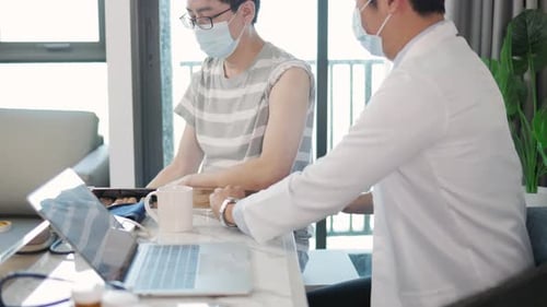 Doctor Giving Injection to Patient in Home Setting