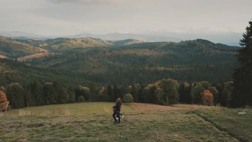 Couple Walks in Beautiful Mountain Landscape, Wide Shot