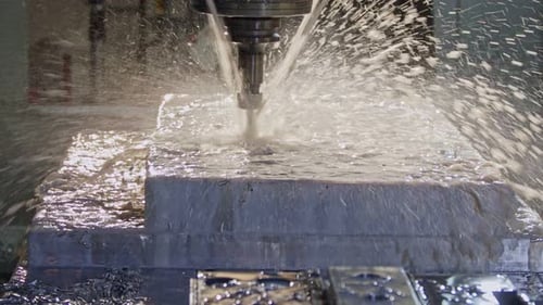 Slow motion of CNC mill manufacturing an advanced metal part