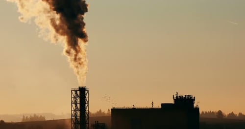 industrial cityscape with with smoking factory