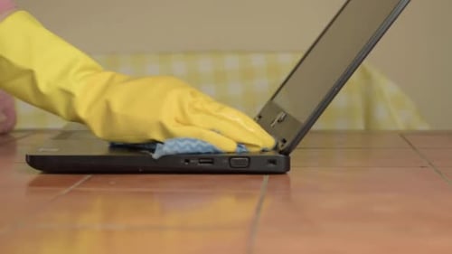 Laptop Keyboard Cleaning with a Cloth and Gloves