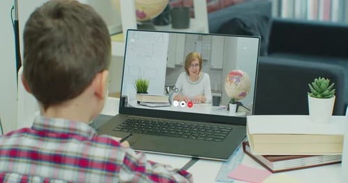 Child Takes Online Math Lesson at Home