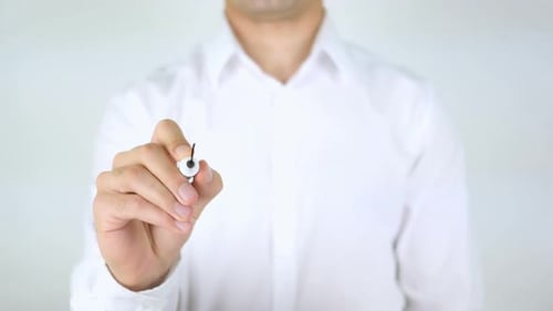 Hand Writes Emergency on Clear Surface