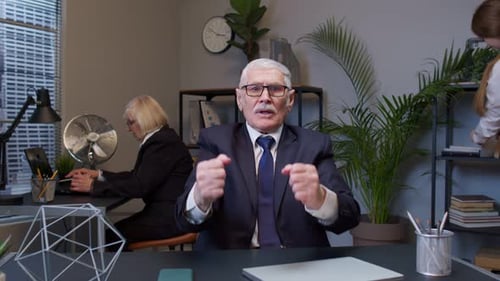 Upset Business Man Loudly Yells Waving Hands From Rage at Office Workplace Screaming Angry Furious