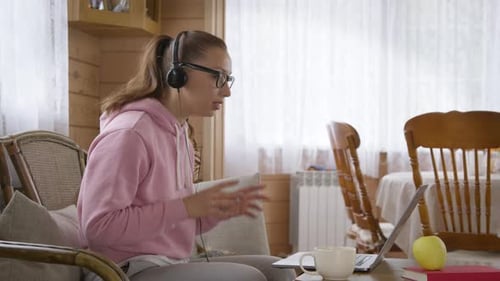 Woman on Laptop Talking, Home Interior