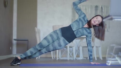 Wide Shot of Slim Caucasian Woman in Sportswear Working Out on Exercise Mat, Portrait of Young
