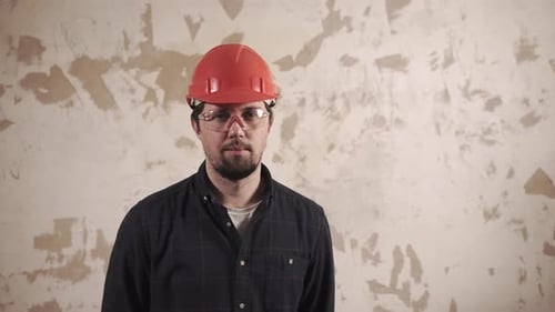 Man Wearing Hard Hat and Safety Goggles