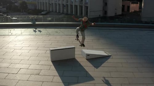 Aerial View of Skillful Skater Sliding on Curb