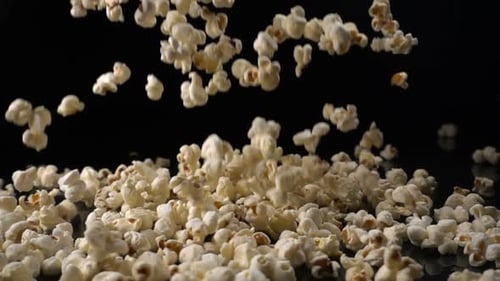 Popcorn Falls on a Black Surface