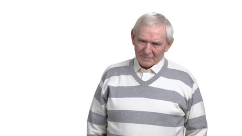 Senior Man Massaging Temples Due to Headache