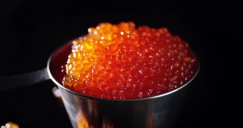 Bowl of Sparkling Orange Caviar Close Up