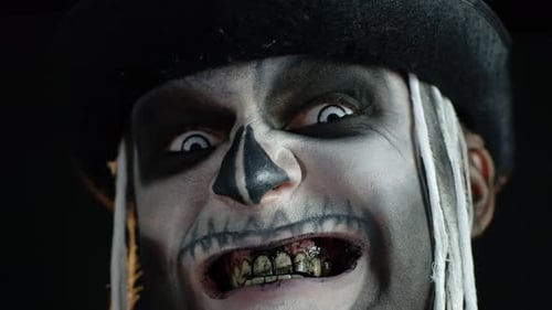 Man in Skull Makeup Smiling in Close-Up