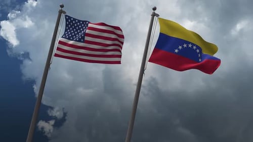 Waving United States and Venezuela Flags Under Cloudy Sky