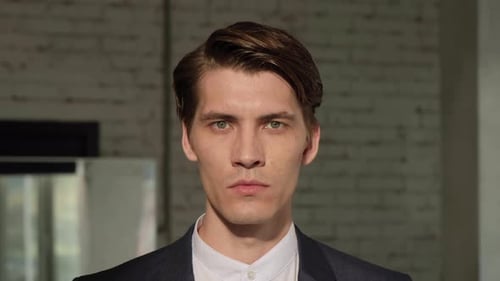 Handsome european man with trendy hairdo. Portrait of a handsome middle aged man