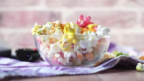 Colorful Candy Popcorn and TV Remote at Home