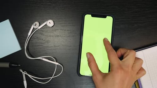 Smartphone with green screen in table. Chroma key