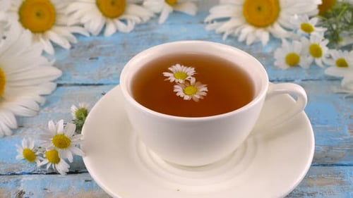 Cup of Chamomile Tea with Flowers