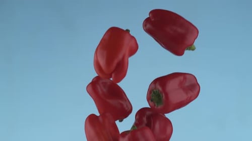 Red Bell Peppers Falling in Slow Motion