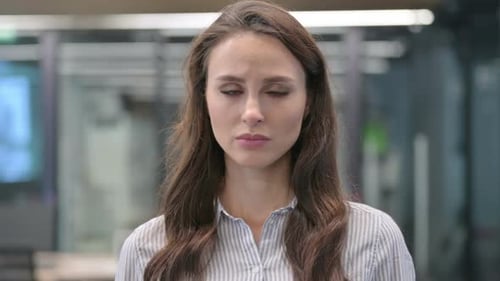 Woman Looks Thoughtful and Sad in Close Up