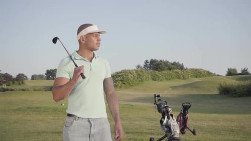 Portrait Cute Smiling Confident Successful Middle Eastern Man with a Golf Club Standing