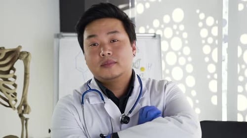 Young Adult Doctor in a White Office