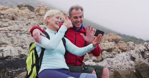 Couple Video Calling During an Outdoor Coastal Adventure