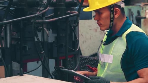 Smart Factory Worker Using Machine in Factory Workshop