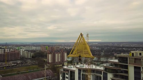 Aerial Footage of a Tower Crane at Construction Site of New Office Building