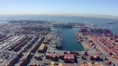 Cargo containers in busy port, aerial. Drone shot.