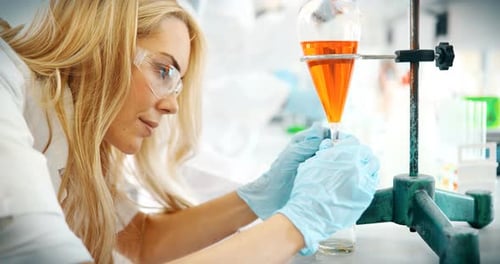 Female Scientist Conducting Experiment in Lab