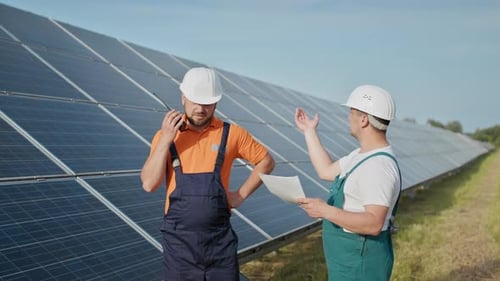 Technician of Energy Checking the Solar Cell Panels at Solar Farm Energy