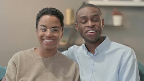 Happy Young Adults Talking and Smiling Indoors