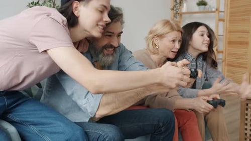 Family Having Fun Playing Video Games Together