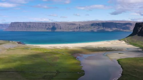 Iceland. Aerial view on the coast line, mountains and ocean. Beach and sea from air