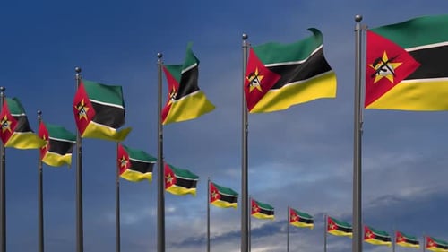 Realistic Waving Mozambique Flags Against a Blue Sky