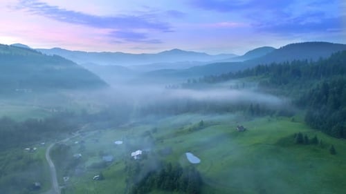 Foggy Mountain Valley at Sunrise Aerial View
