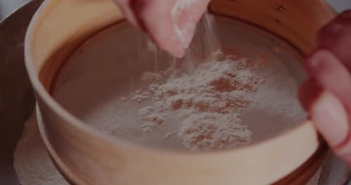 Sieving Flour for Baking Preparation