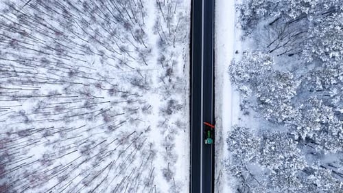 Transportation in winter. Snowplow clearing snow from the road.